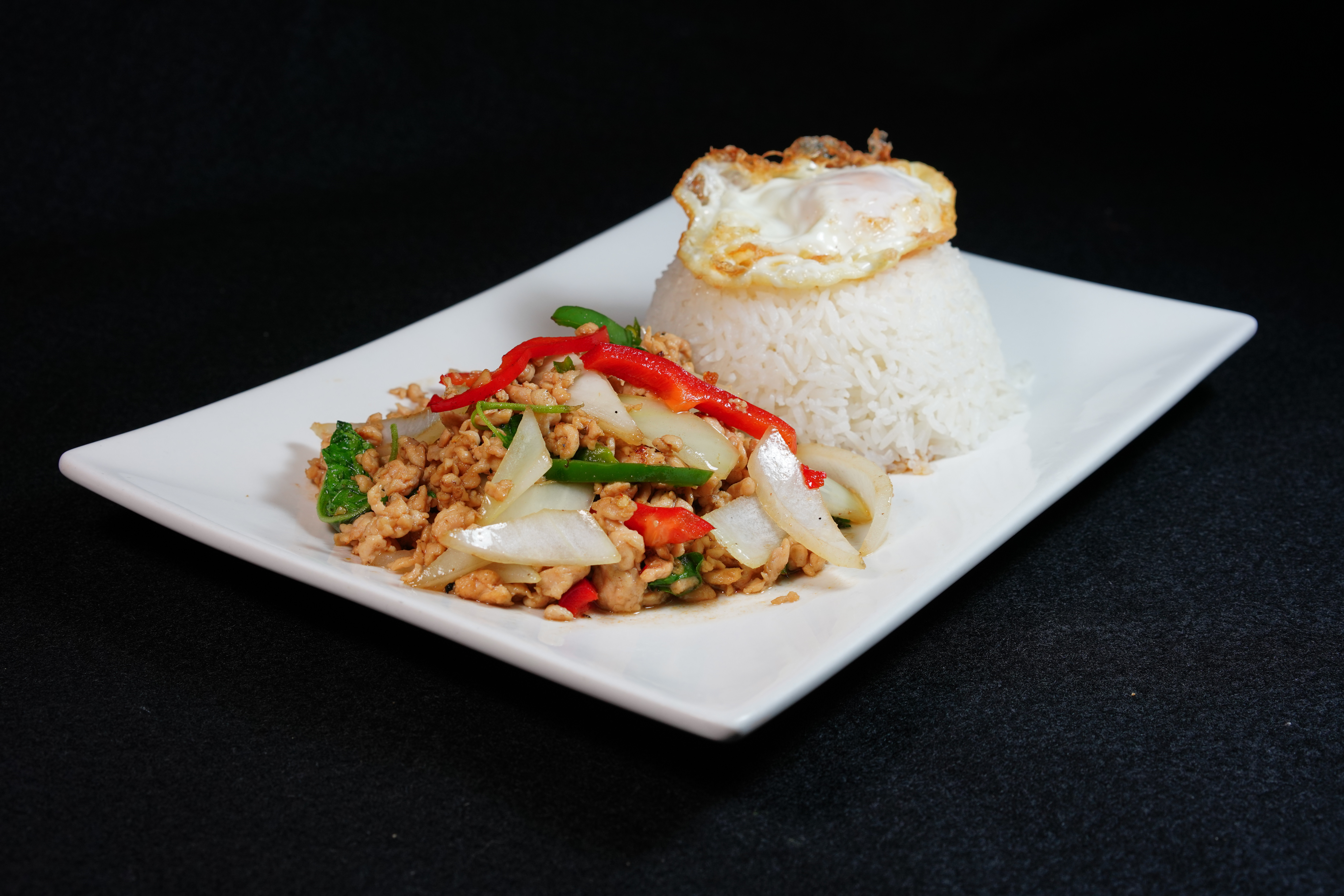 Order Spicy Kra Pao over Rice (Thai hot basil) food online from Long Beach Thai Restaurant store, Long Beach on bringmethat.com