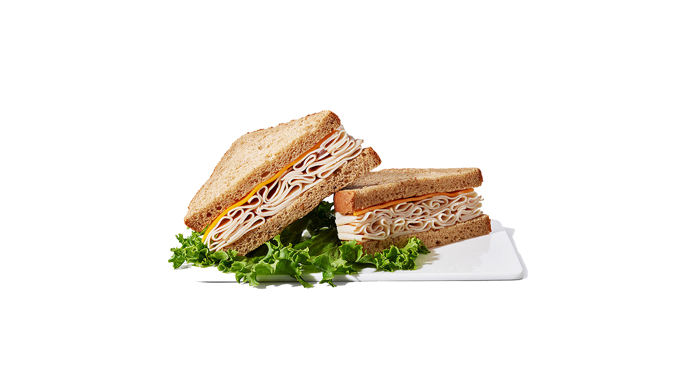 Order Turkey Cheddar on Wheat Sandwich food online from Chevron Extramile store, Fountain Valley on bringmethat.com