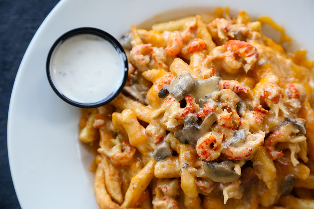 Order Cajun Crawfish Poutine food online from Mambo store, New Orleans on bringmethat.com