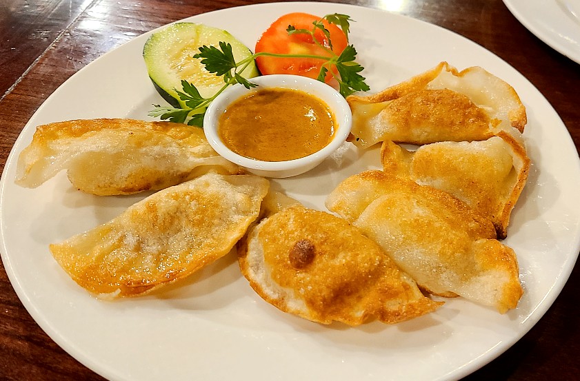Order 23. Malaysian Curried Chicken Potstickers  food online from The Little Kitchen of Westport store, Westport on bringmethat.com