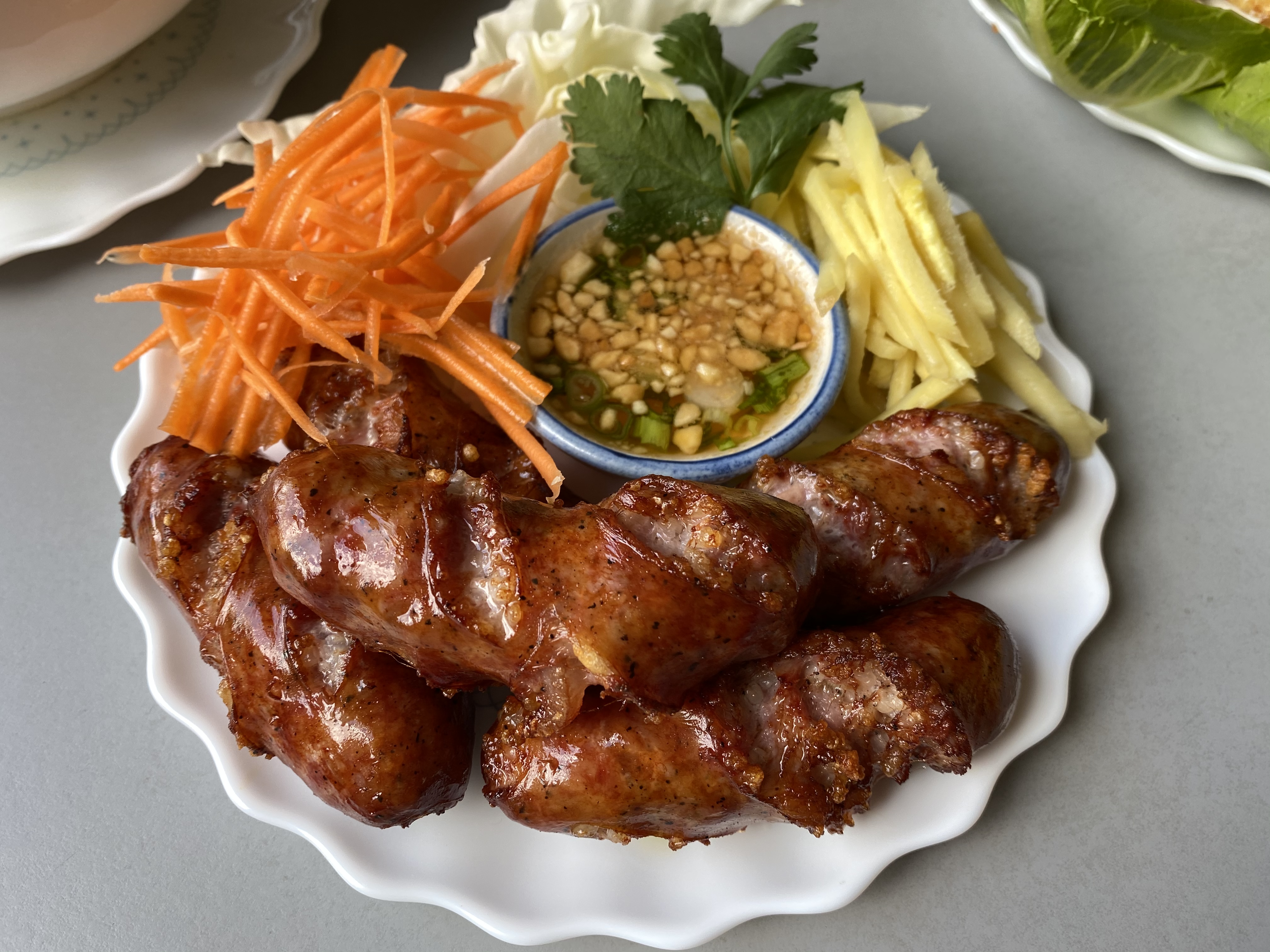 Order Pork Sausage Thai Esan Style ( 4 pieces ) food online from Pho Thai-Lao Kitchen store, Maywood on bringmethat.com
