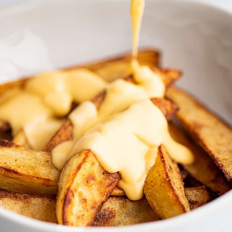 Order Cheesy Wedge Fries - Side food online from Fox's Pizza Den store, Parkhill on bringmethat.com