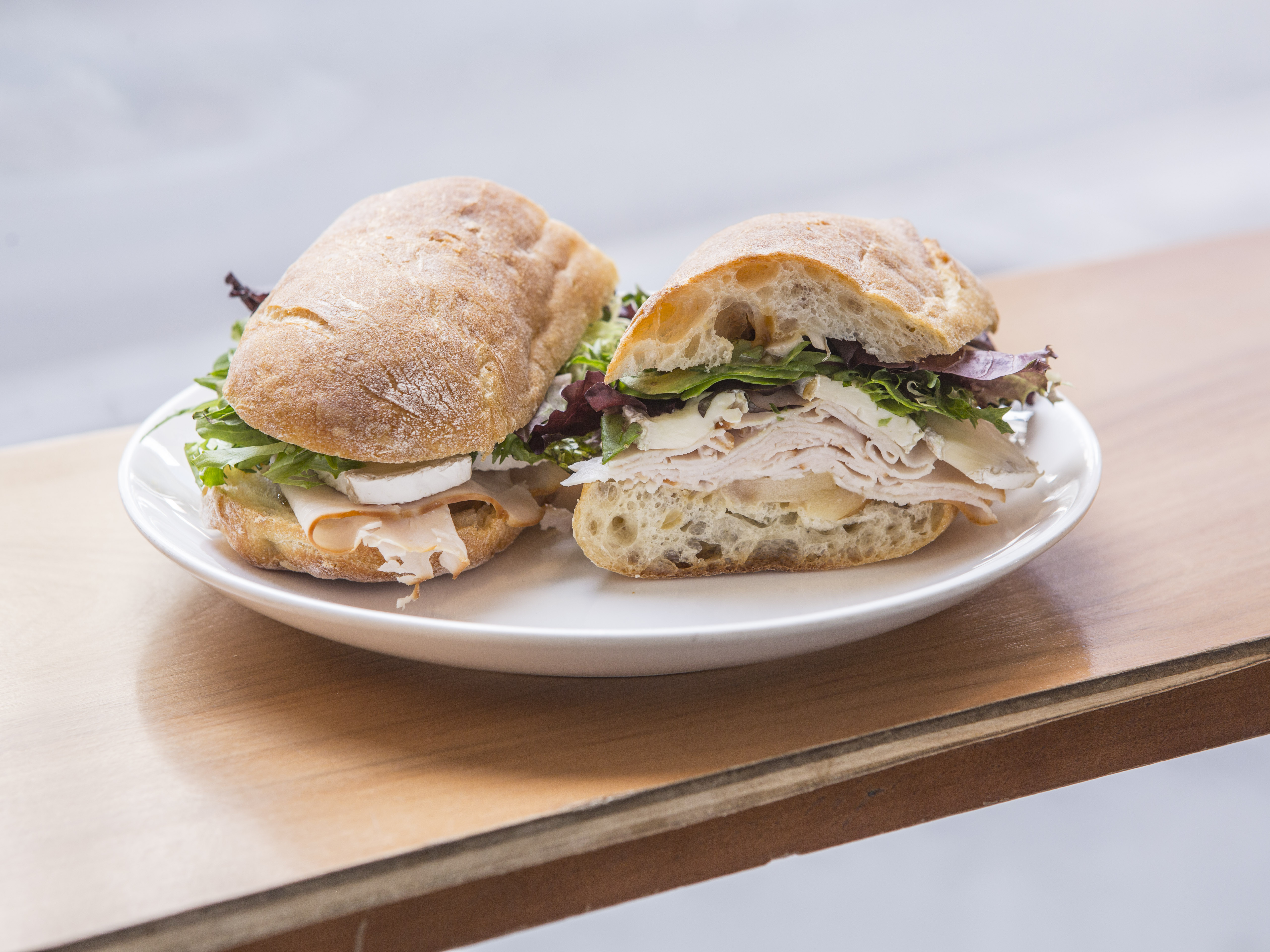 Order Smoked Turkey and Brie Sandwich food online from Blue Spoon Coffee Company store, New York on bringmethat.com