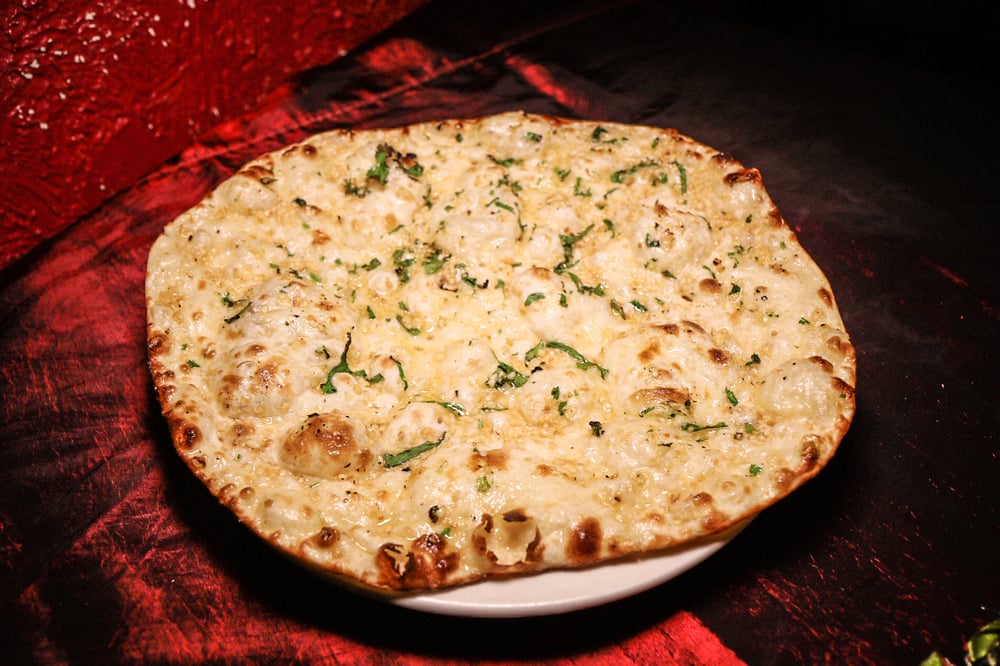 Order Garlic Naan food online from Raagini store, Baldwin on bringmethat.com