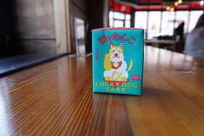 Order Lucky Dog Sake, 180ml sake (13.2% alcohol by volume) food online from Furious Spoon store, Chicago on bringmethat.com