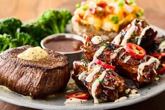Order NEW!  Sirlion & Aussie Chook Ribs* food online from Outback Steakhouse store, Charlotte on bringmethat.com