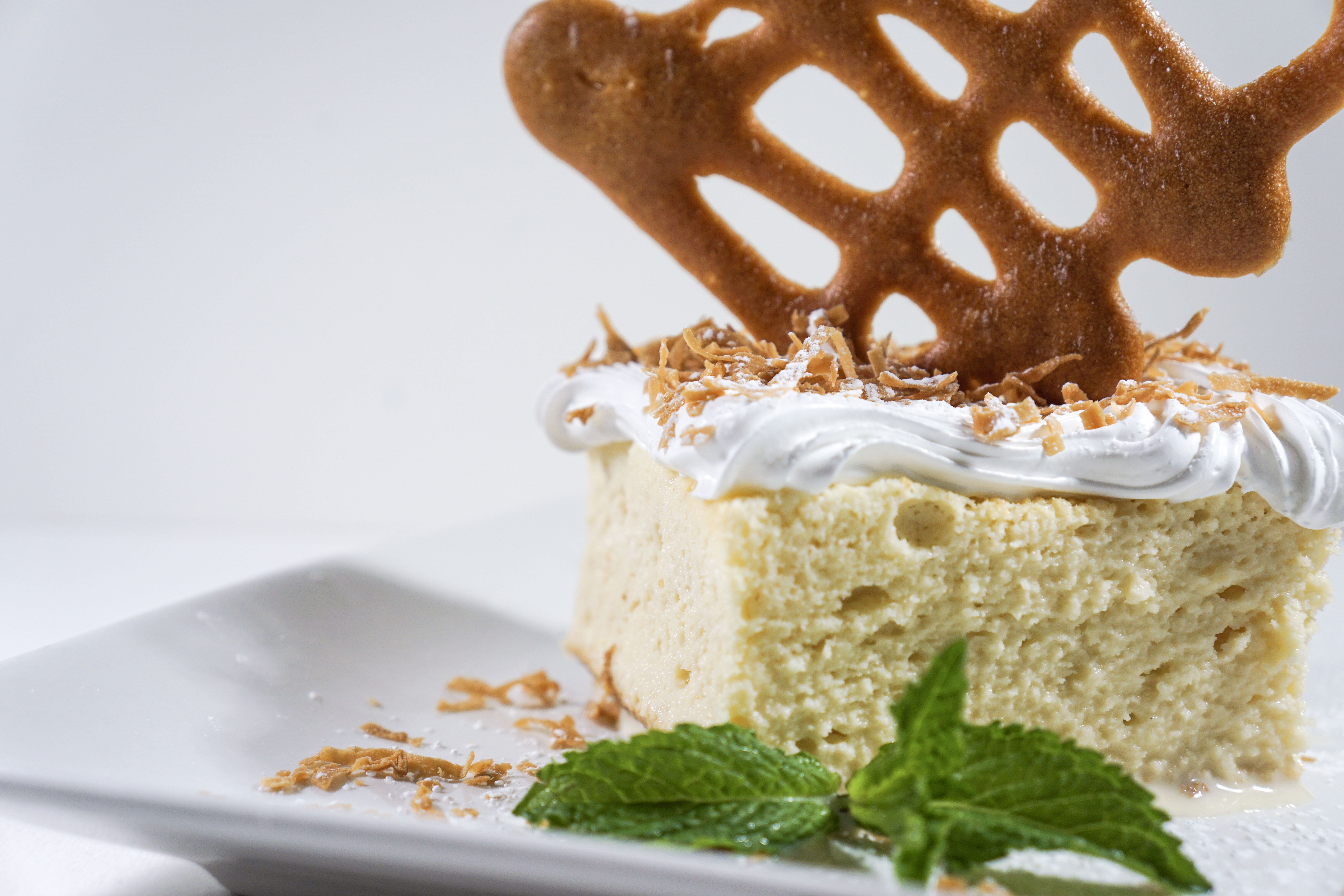 Order Coconut Tres Leches food online from Mezza Grille store, Houston on bringmethat.com