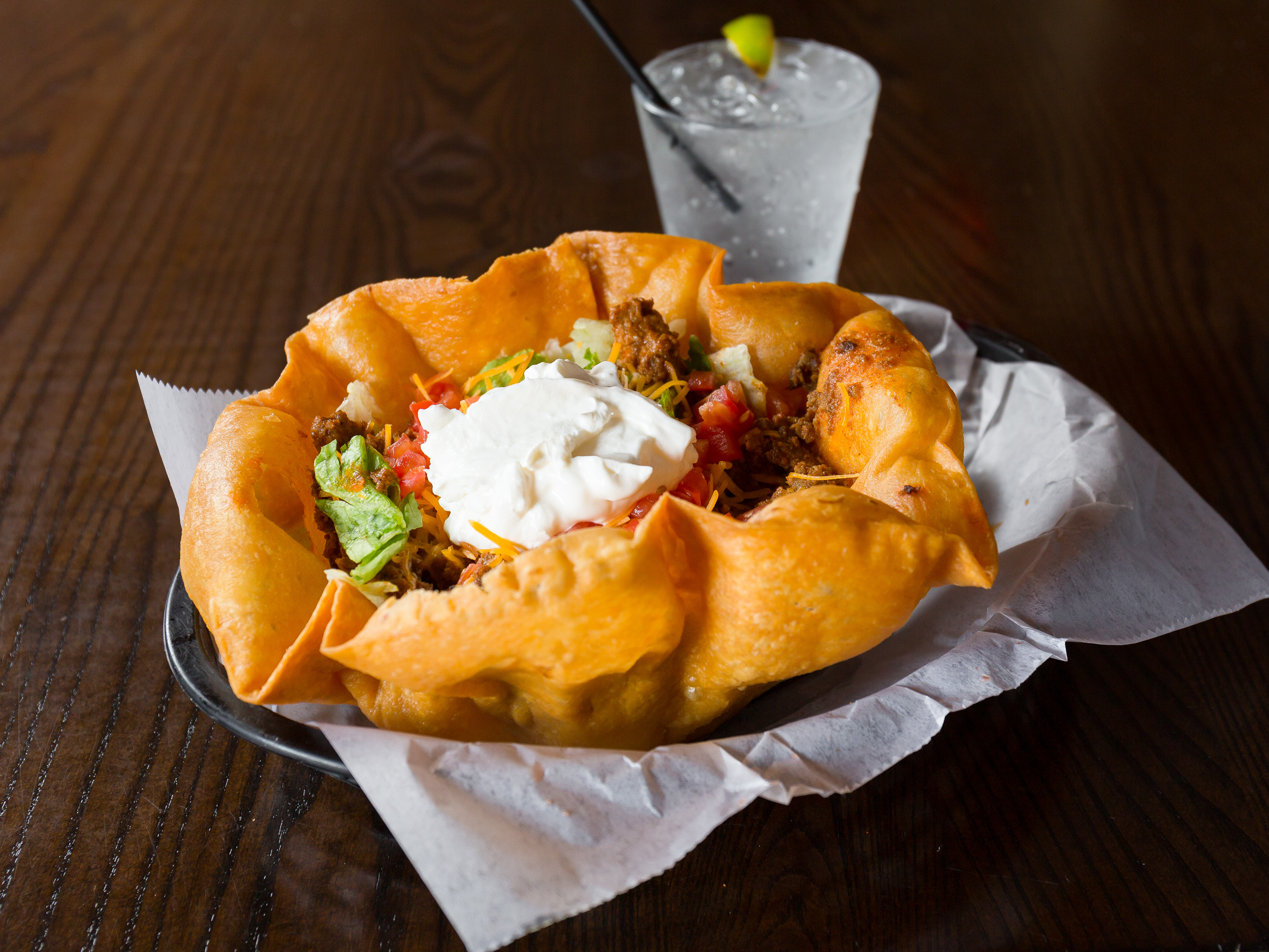 Order Taco Salad food online from Whiskey River - Ames store, Ames on bringmethat.com