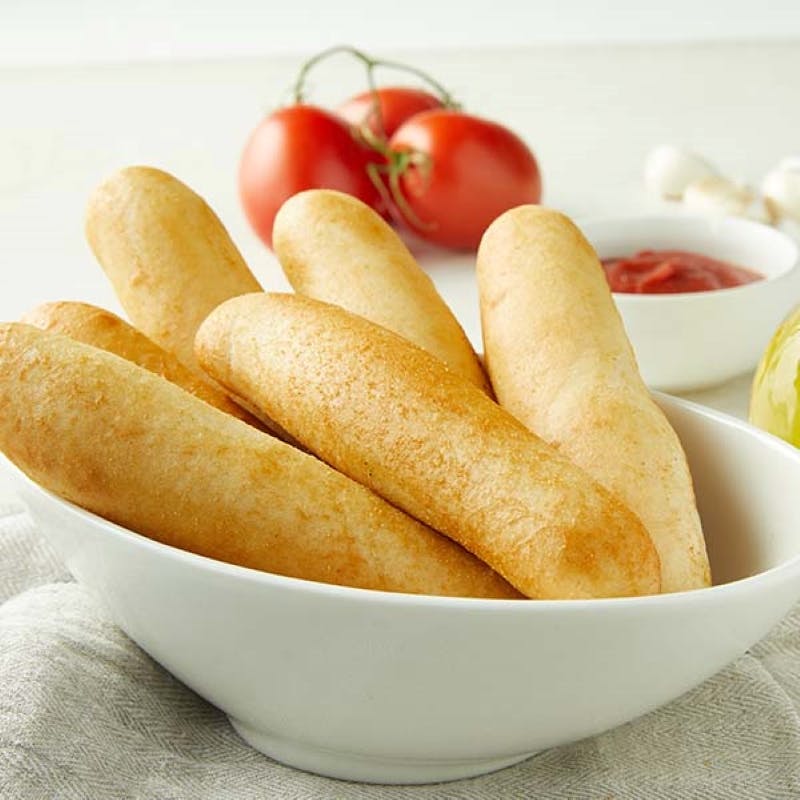 Order Italian Garlic Breadsticks - Side (2 Pieces) food online from Donatos Pizza store, Hudson on bringmethat.com