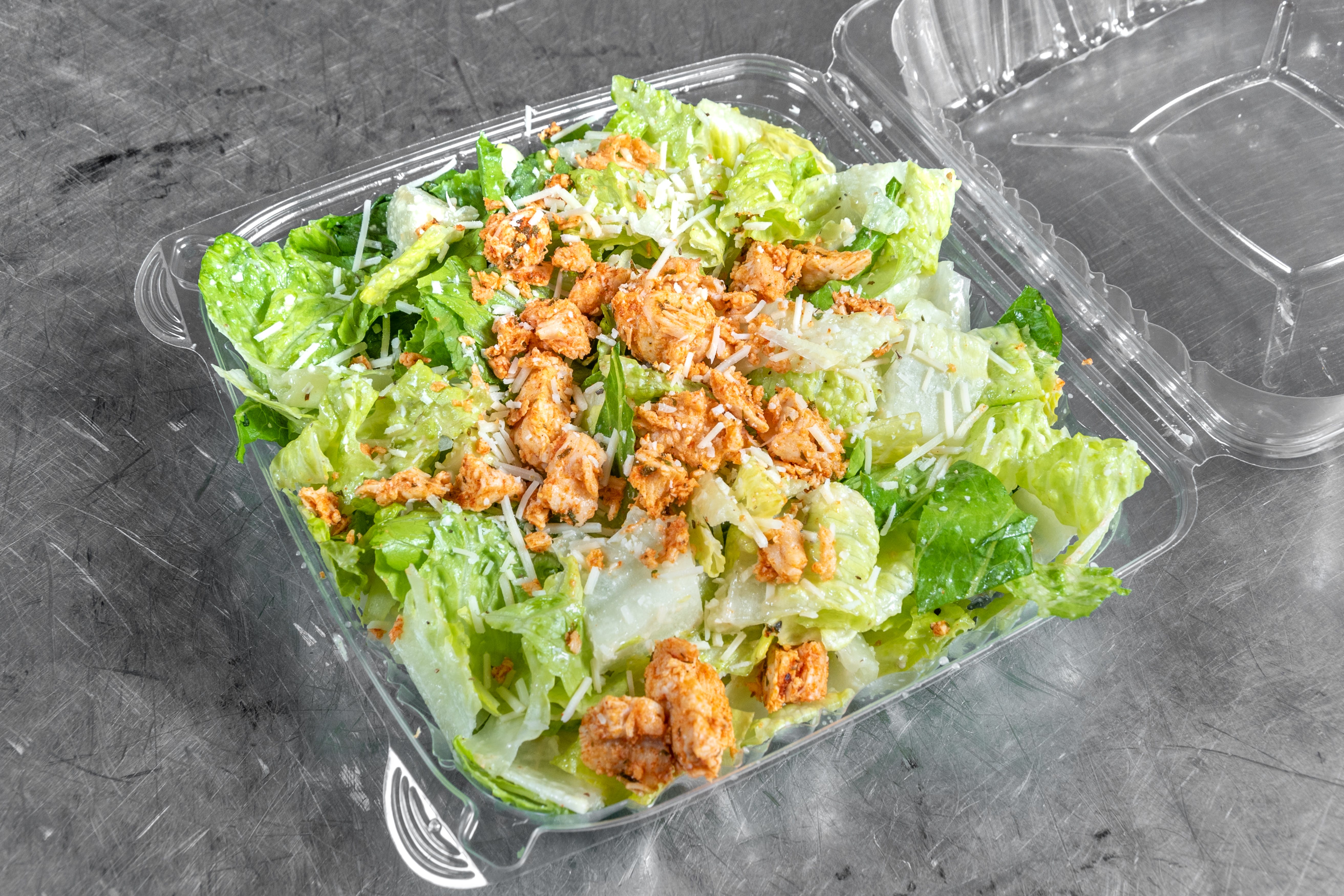 Order Chicken Caesar Salad - Salad food online from Goodfella Pizza store, Los Lunas on bringmethat.com