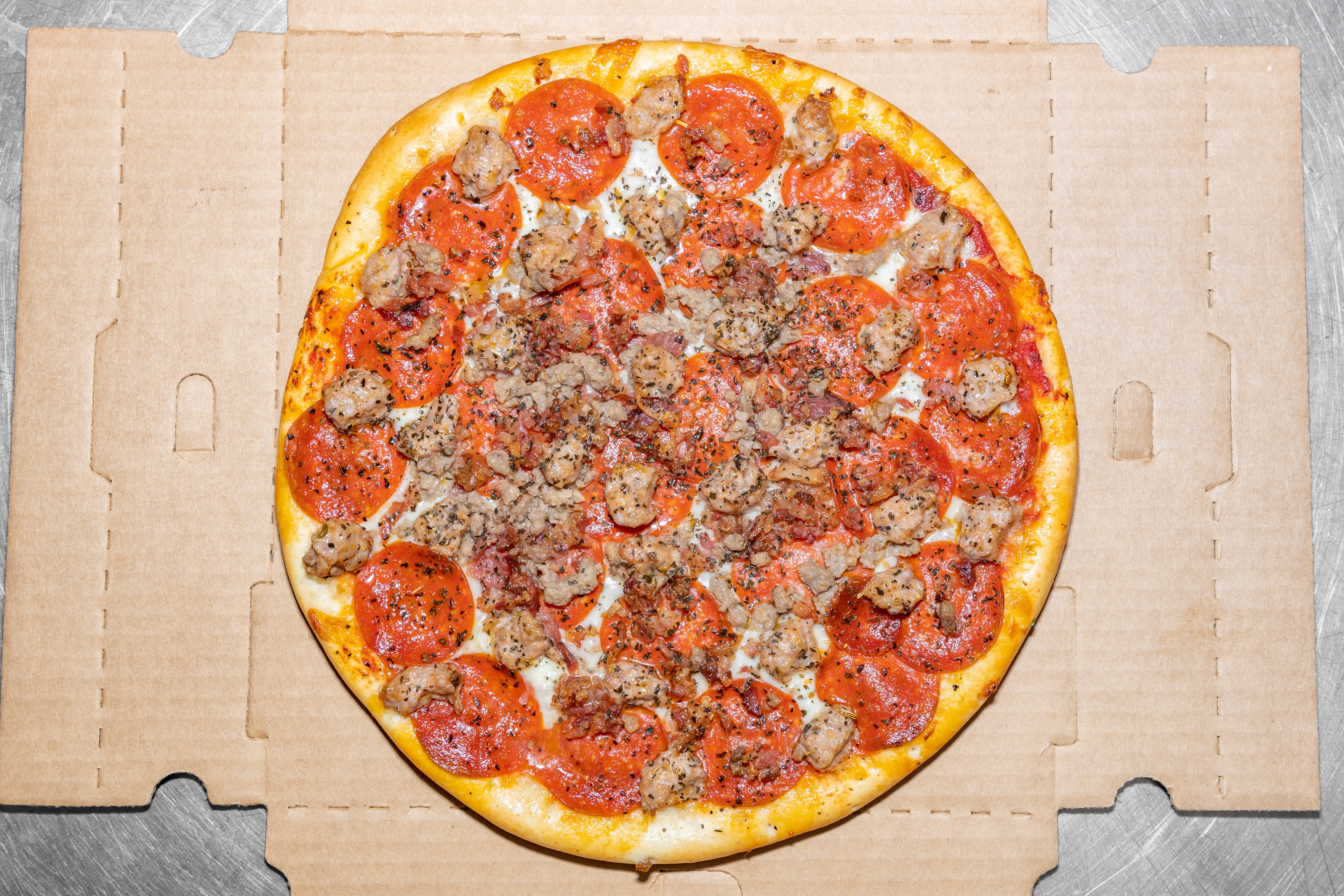 Order Ultimate Meat Thin Crust Pizza - Small 12'' food online from Sicilian Joe's Pizza store, Monee on bringmethat.com