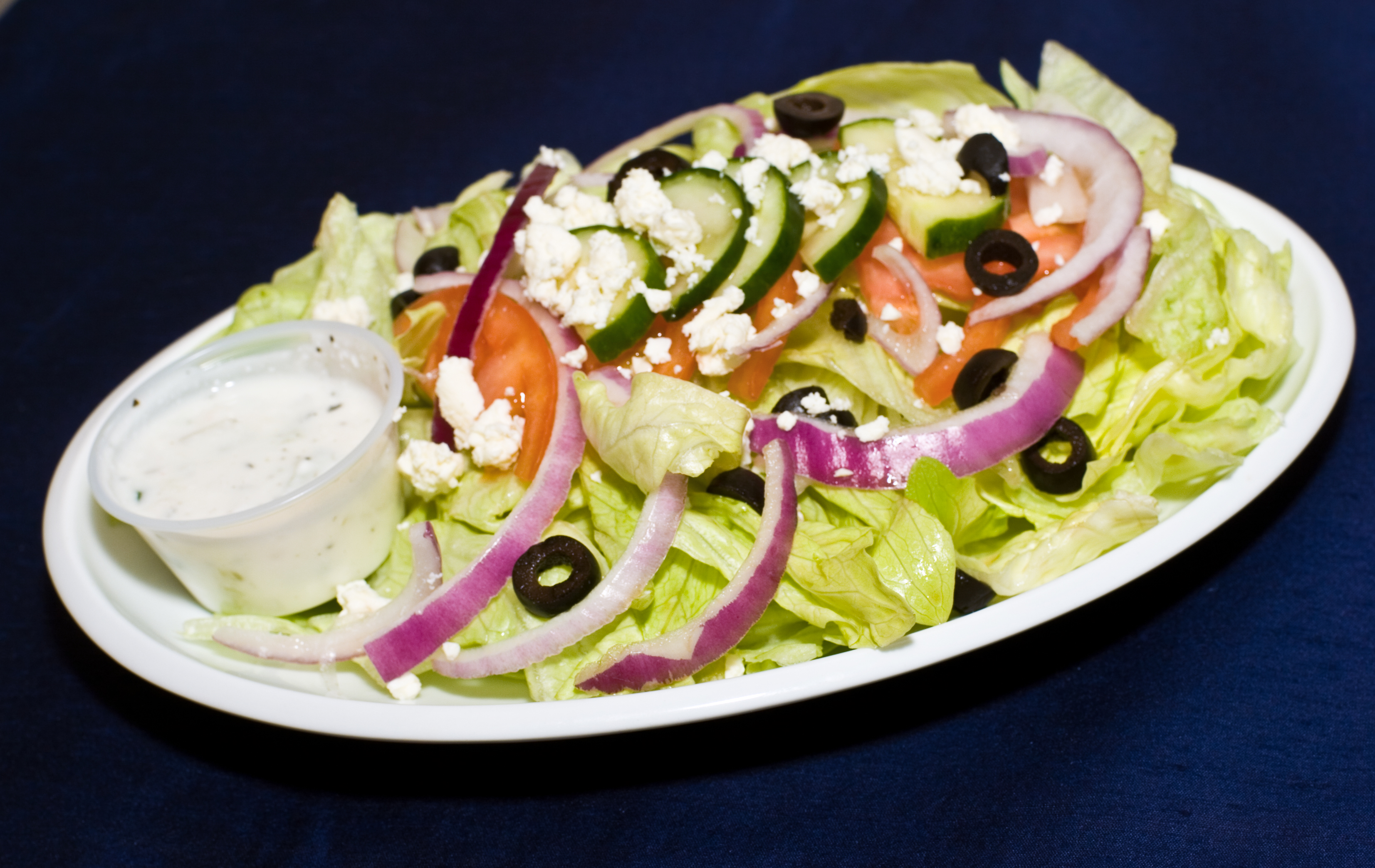Order Greek Salad food online from Kabobi store, Raleigh on bringmethat.com