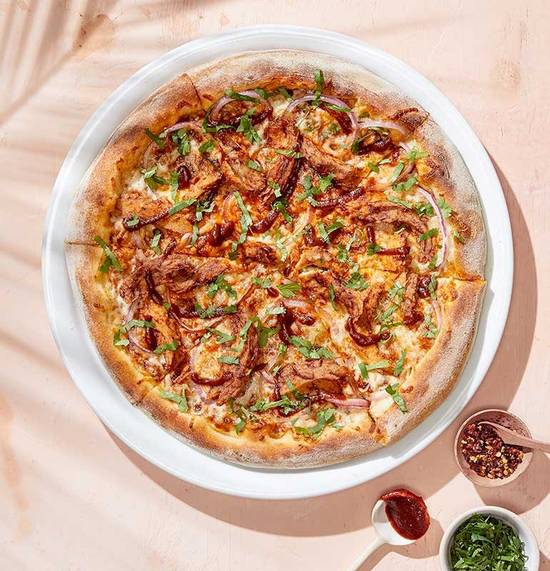 Order PLANT-BASED BBQ CHICKEN PIZZA food online from California Pizza Kitchen store, Troy on bringmethat.com