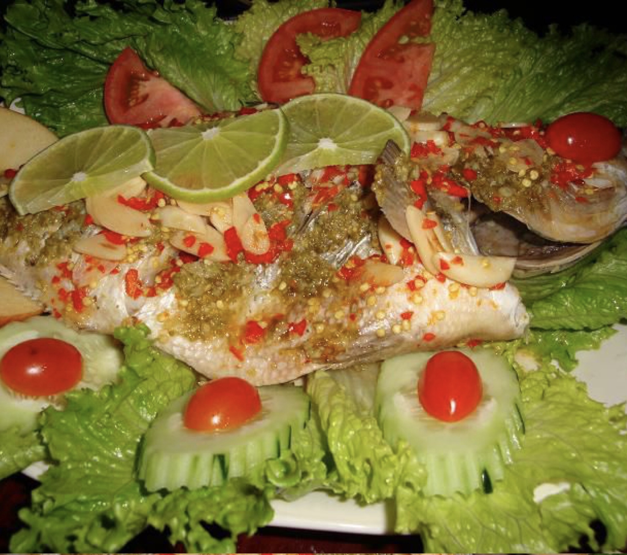 Order Steamed Whole Fish in Garlic Chili Lime juice Sauce food online from Ayada Thai Restaurant Chelsea Market store, New York on bringmethat.com