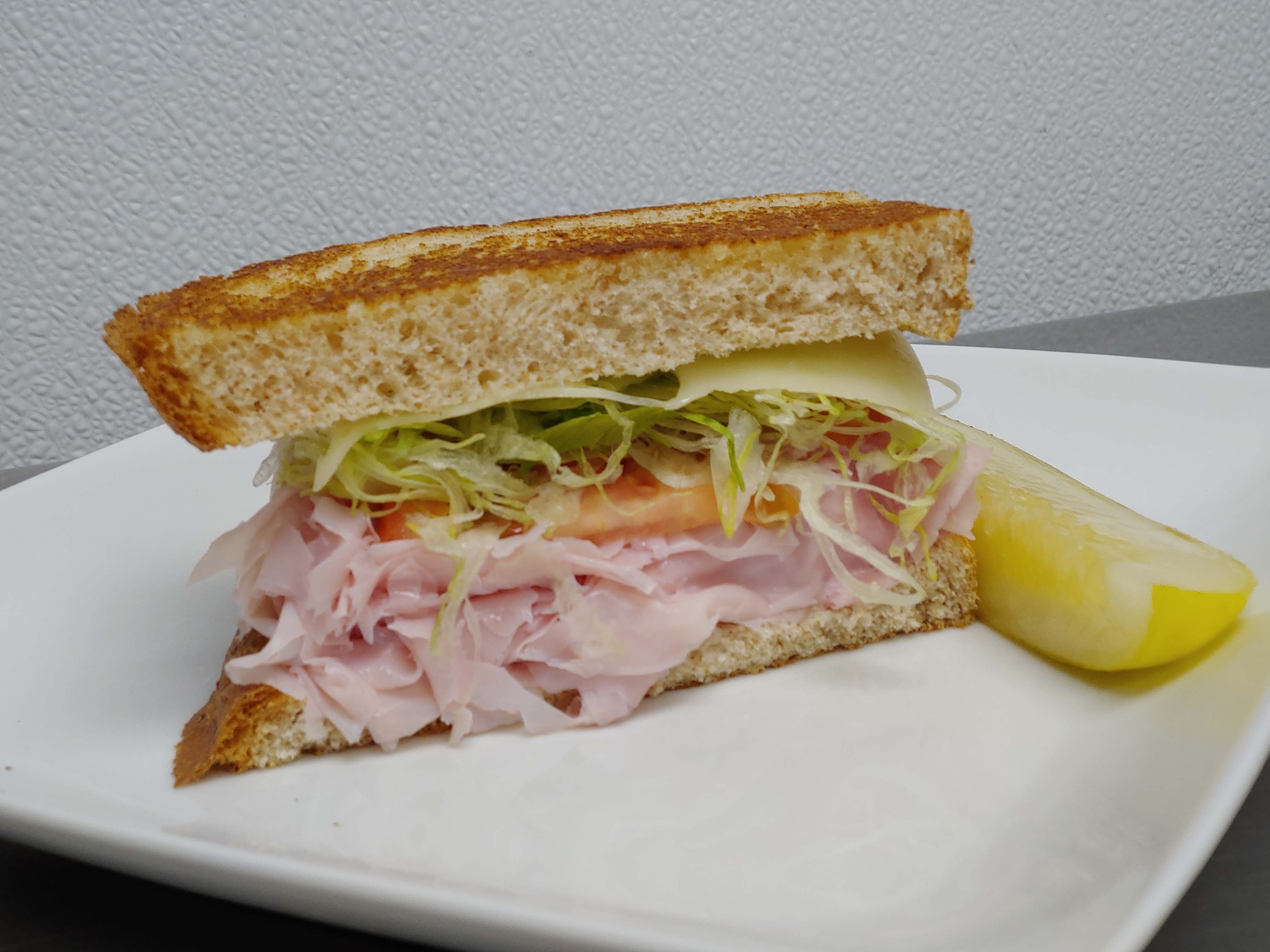 Order 1/2 Ham and Swiss Sandwich food online from Amazing Deli store, Midland on bringmethat.com