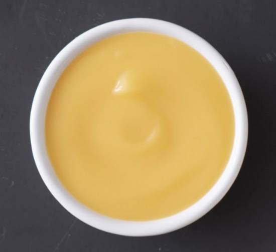 Order Cheese Sauce (2 oz) food online from Wings Over store, Athens on bringmethat.com