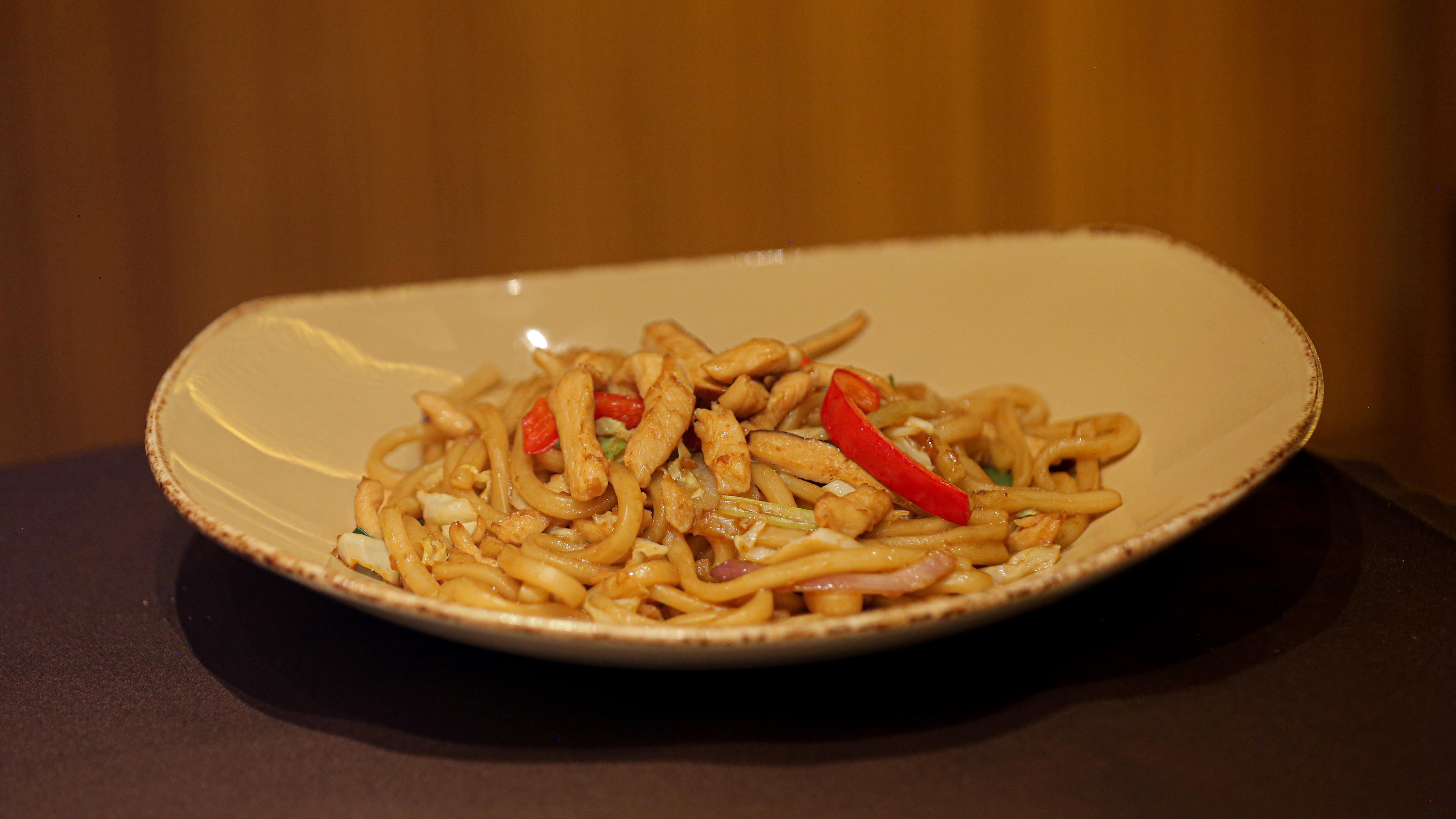 Order Stir-fried  Udon w/Chicken food online from MoCA Asian Bistro - Queens store, Forest Hills on bringmethat.com