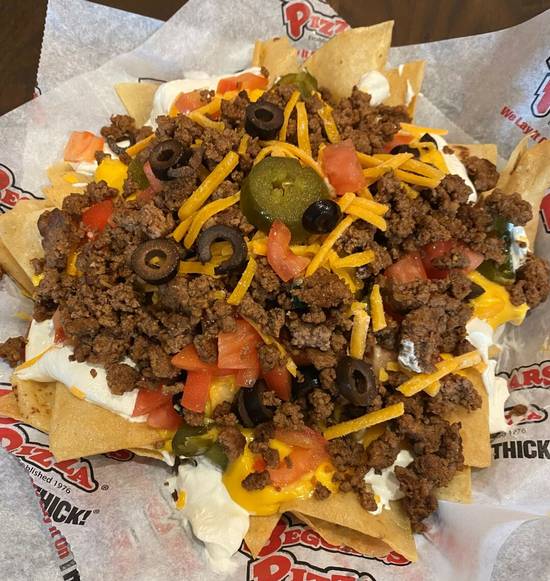Order Loaded Nachos food online from Beggars Pizza store, Chicago on bringmethat.com