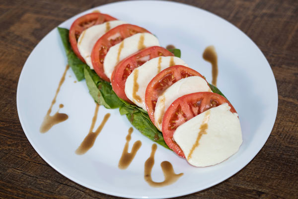 Order Caprese Salad food online from Gionino's Pizzeria store, Orrville on bringmethat.com