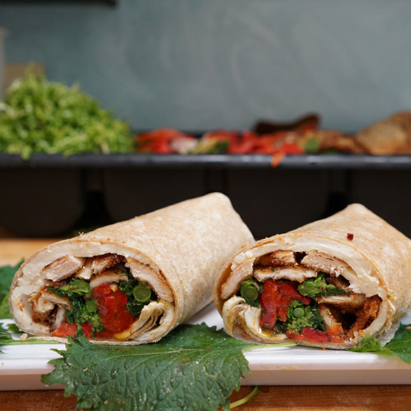 Order Pesto Chicken Wrap food online from Cafe Deli-Cious store, New York on bringmethat.com