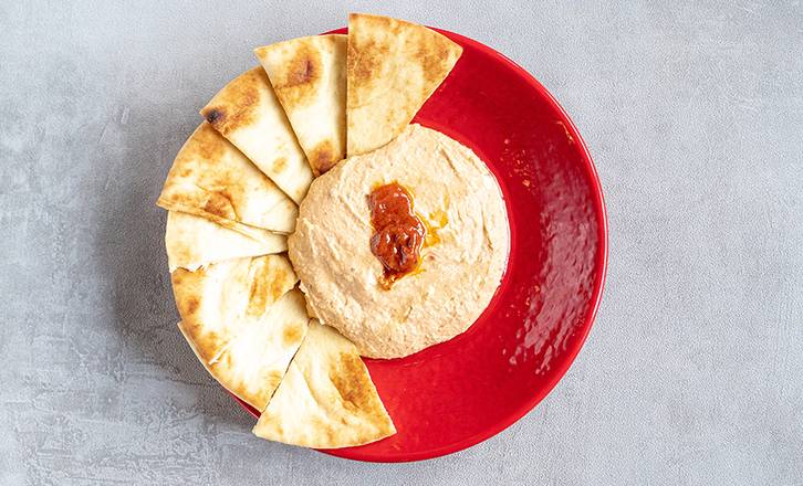 Order Spicy Hummus food online from Zoe Kitchen store, Snellville on bringmethat.com