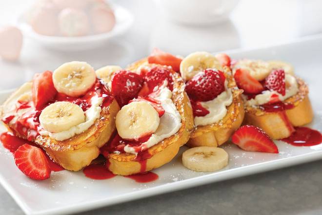 Order Strawberry-Banana Supreme French Toast food online from Village Inn store, Grand Junction on bringmethat.com