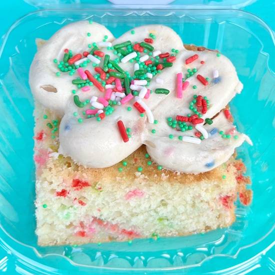 Order Holiday Frosted Birthday Cake Slice food online from The Cookie Dough Cafe store, Portland on bringmethat.com