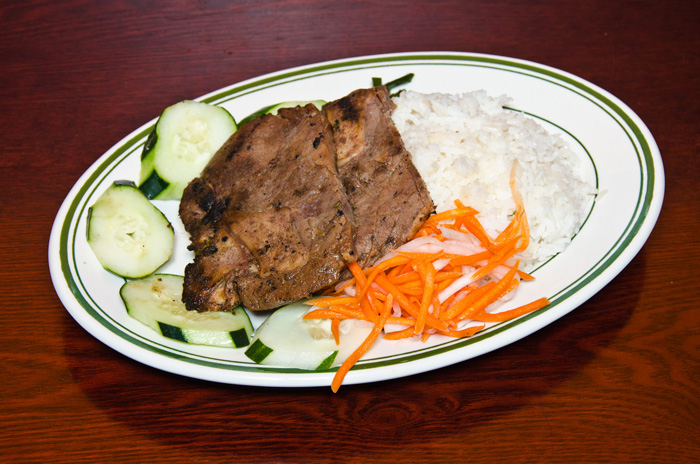 Order Grilled Pork Chop Rice Dish food online from Lotus vietnamese sandwiches store, Brooklyn on bringmethat.com
