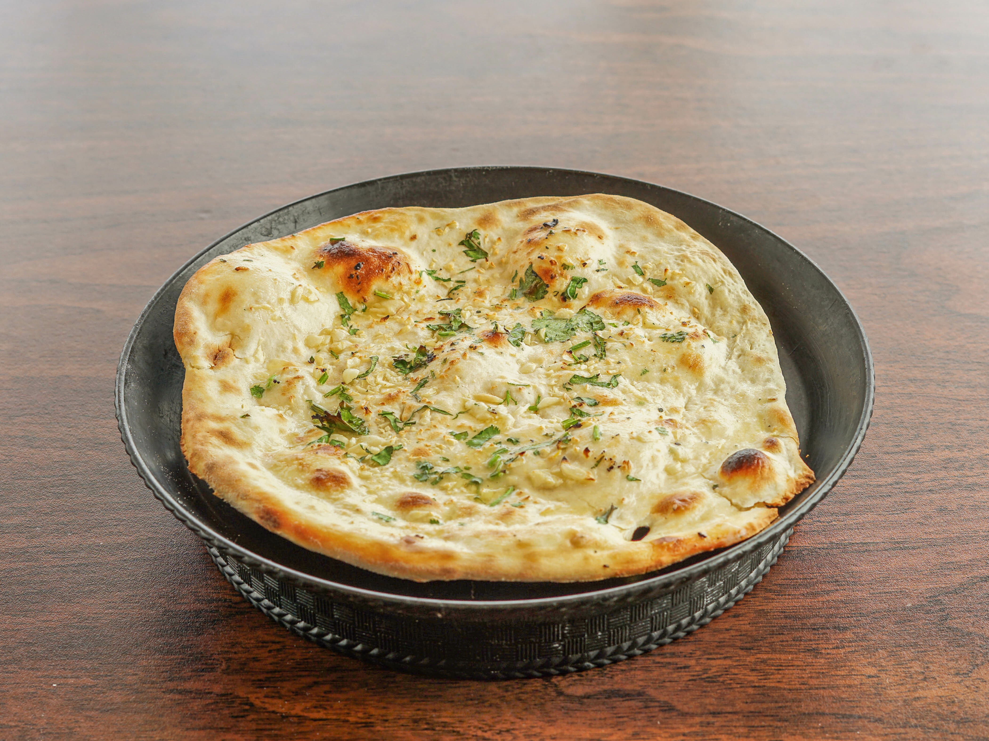 Order Garlic Naan food online from Kitchen of India store, Parkville on bringmethat.com