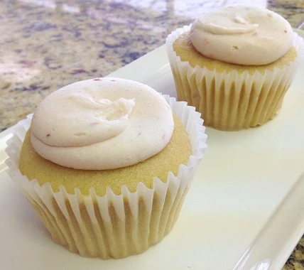 Order Vanilla Cupcake with Strawberry Icing food online from Unrefined Bakery store, Dallas on bringmethat.com