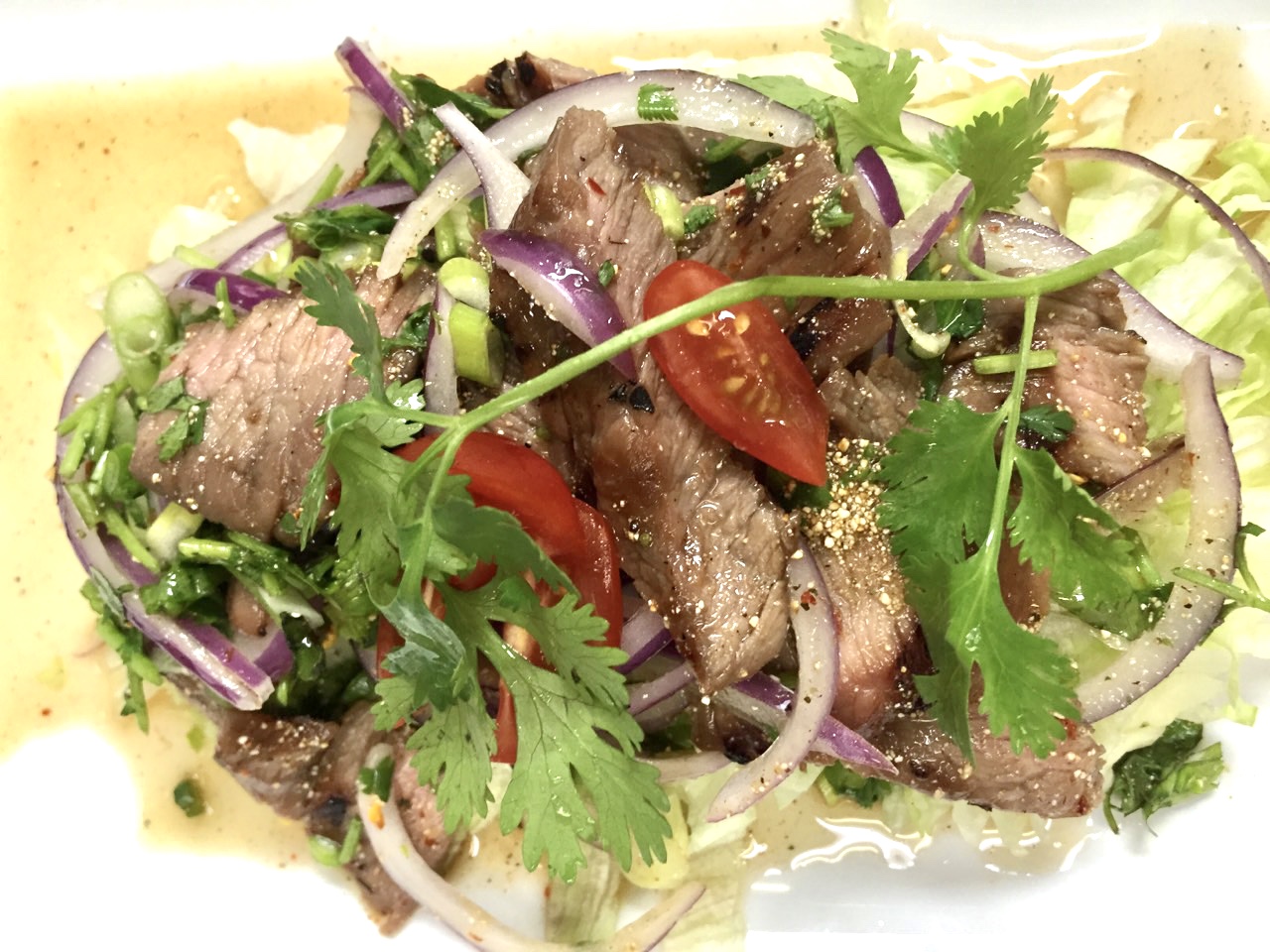 Order Nam Tok Pork food online from Urban Thai store, Arlington on bringmethat.com