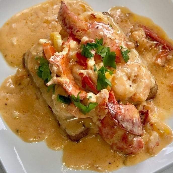 Order Shrimp and Grits with Creamy White Wine Sauce food online from Cleveland Breakfast Club store, Cleveland on bringmethat.com
