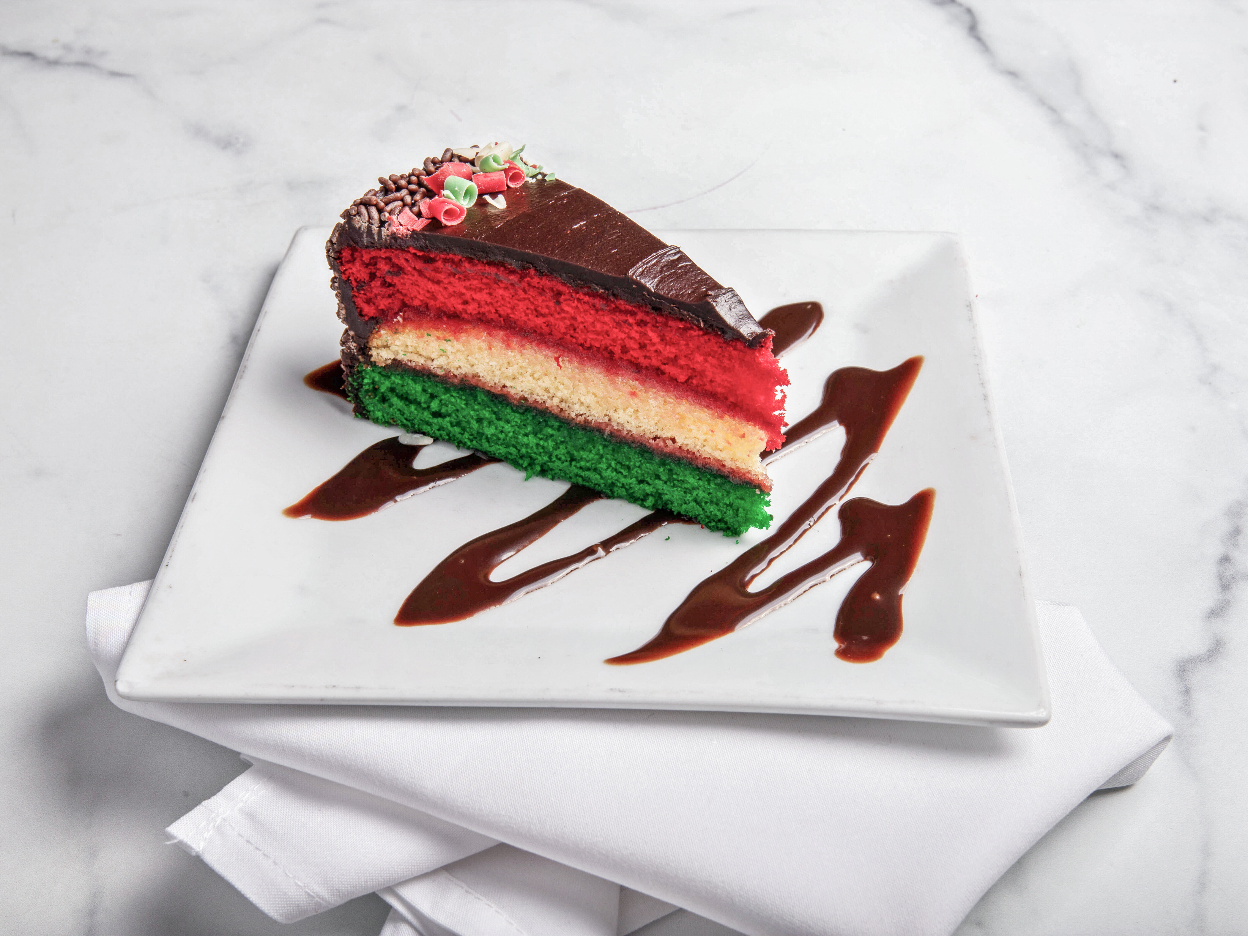 Order Italian Rainbow Cookie Cake food online from Cafe Spiga store, Mount Sinai on bringmethat.com