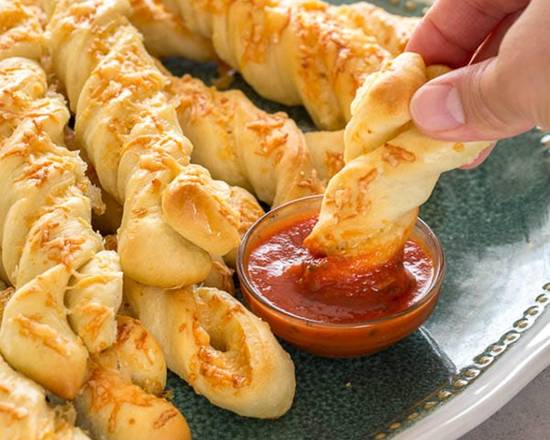 Order Garlic Parmesan Twists™ (12 Twists) food online from Round Table Pizza store, Millbrae on bringmethat.com