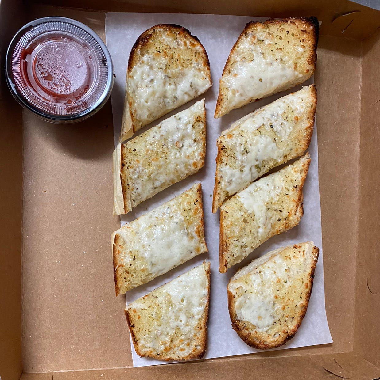 Order Garlic Bread with Sauce - Small food online from Pujols Pizzeria store, Bethlehem on bringmethat.com