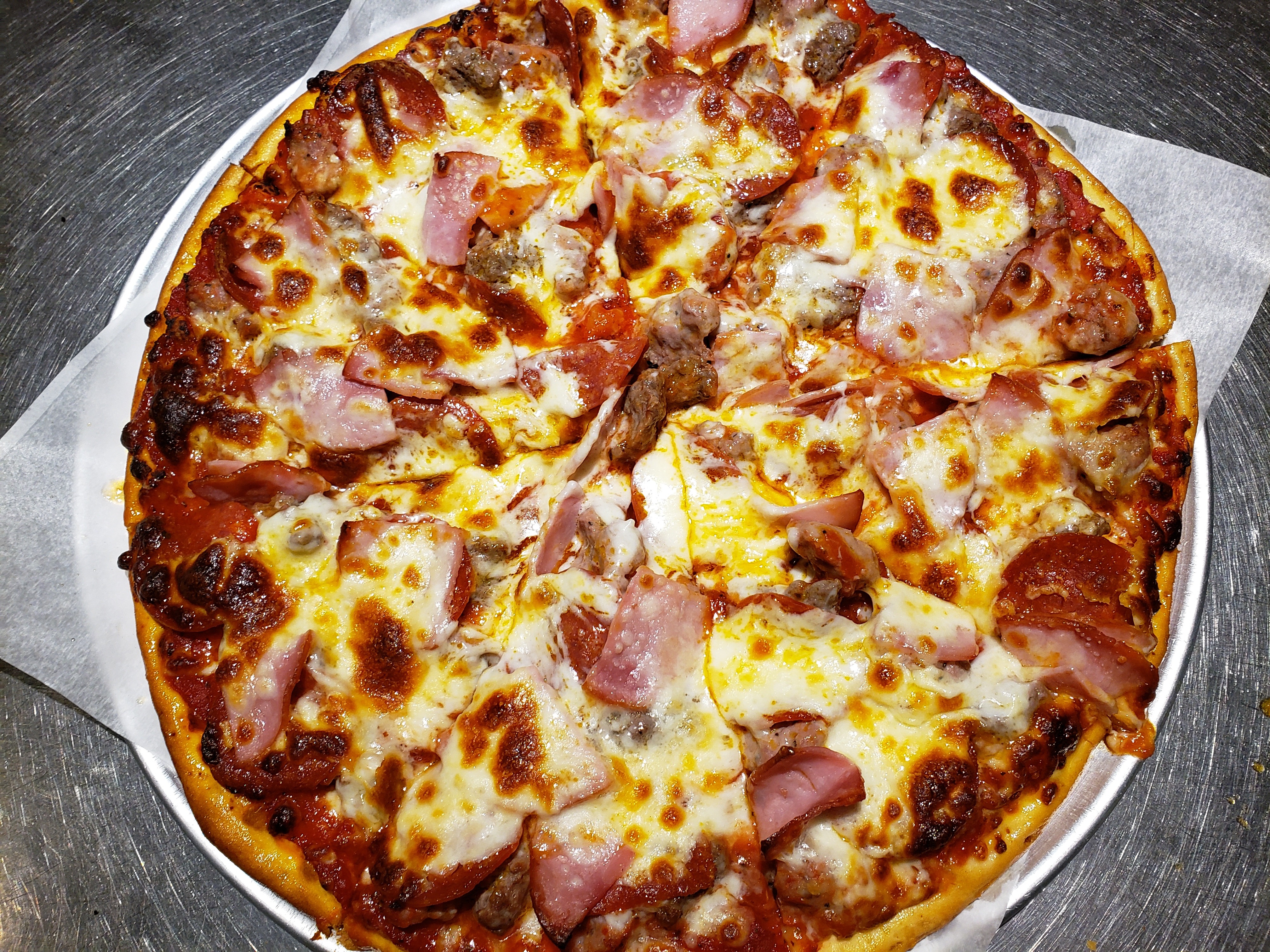 Order Meat Lovers Pizza | 12" food online from Pagliais Pizza store, Johnston on bringmethat.com