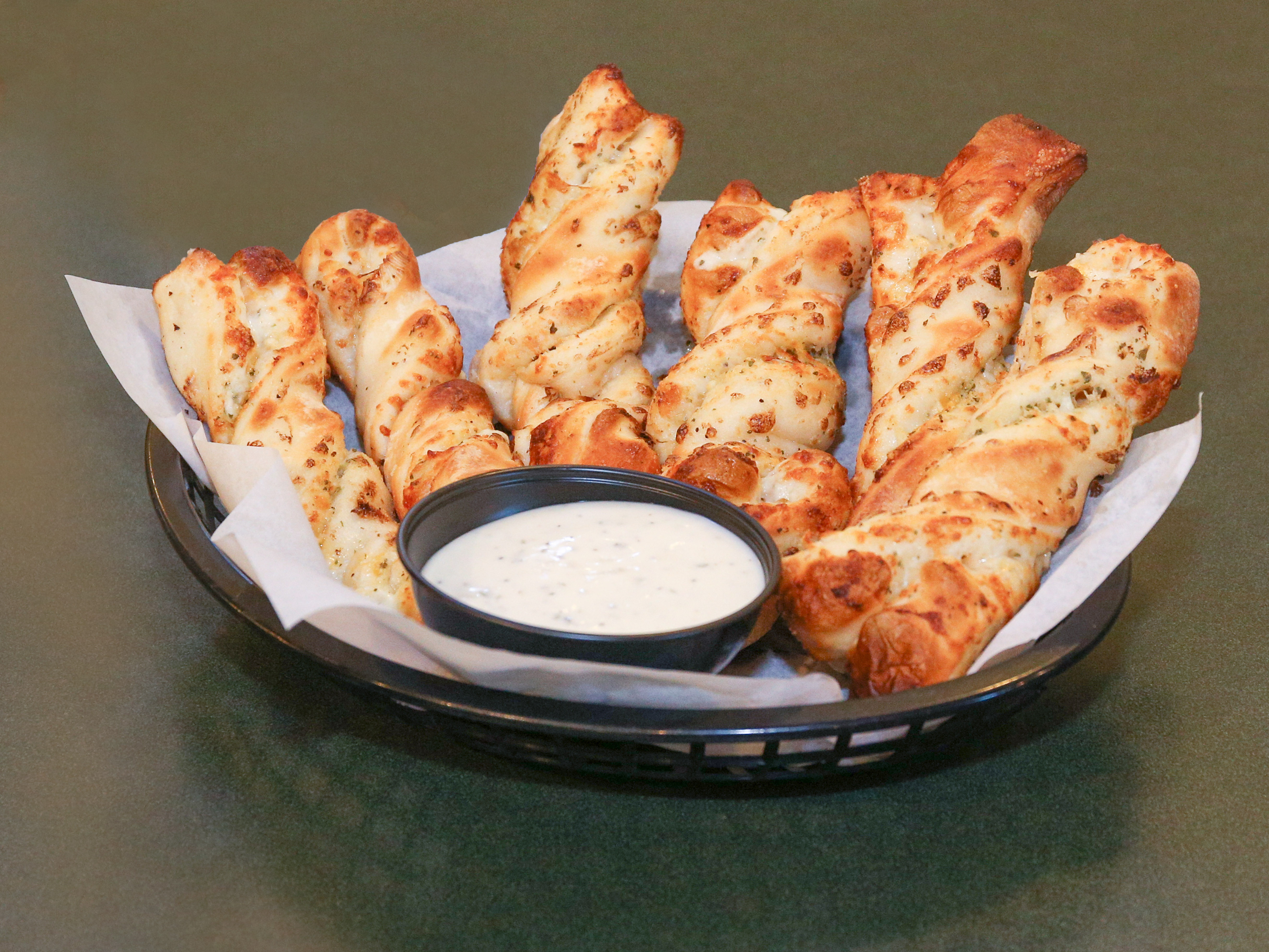 Order 3 Garlic Parmesan Twists food online from Round Table Pizza store, Menlo Park on bringmethat.com