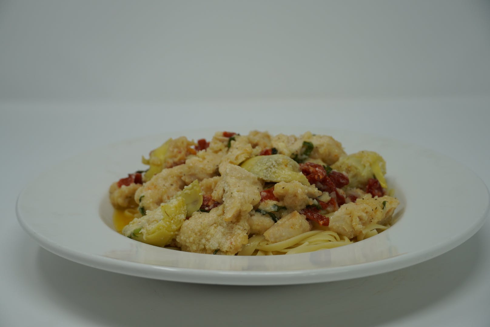 Order Shrimp Carciofi - Pasta food online from DeNunzio's Italian Restaurant - Latrobe store, Latrobe on bringmethat.com
