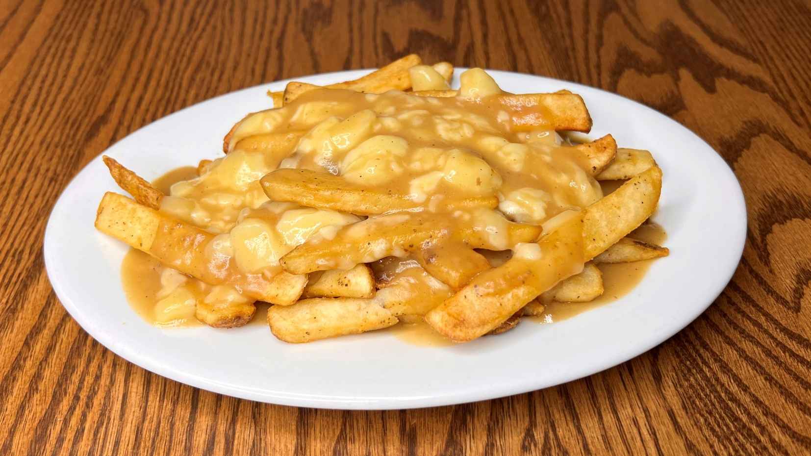 Order Traditional Poutine food online from Elephant & Castle store, Chicago on bringmethat.com