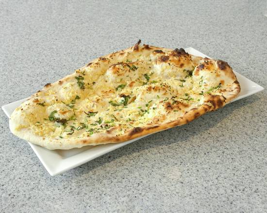 Order Garlic Naan food online from Indian Curry store, Colombus on bringmethat.com