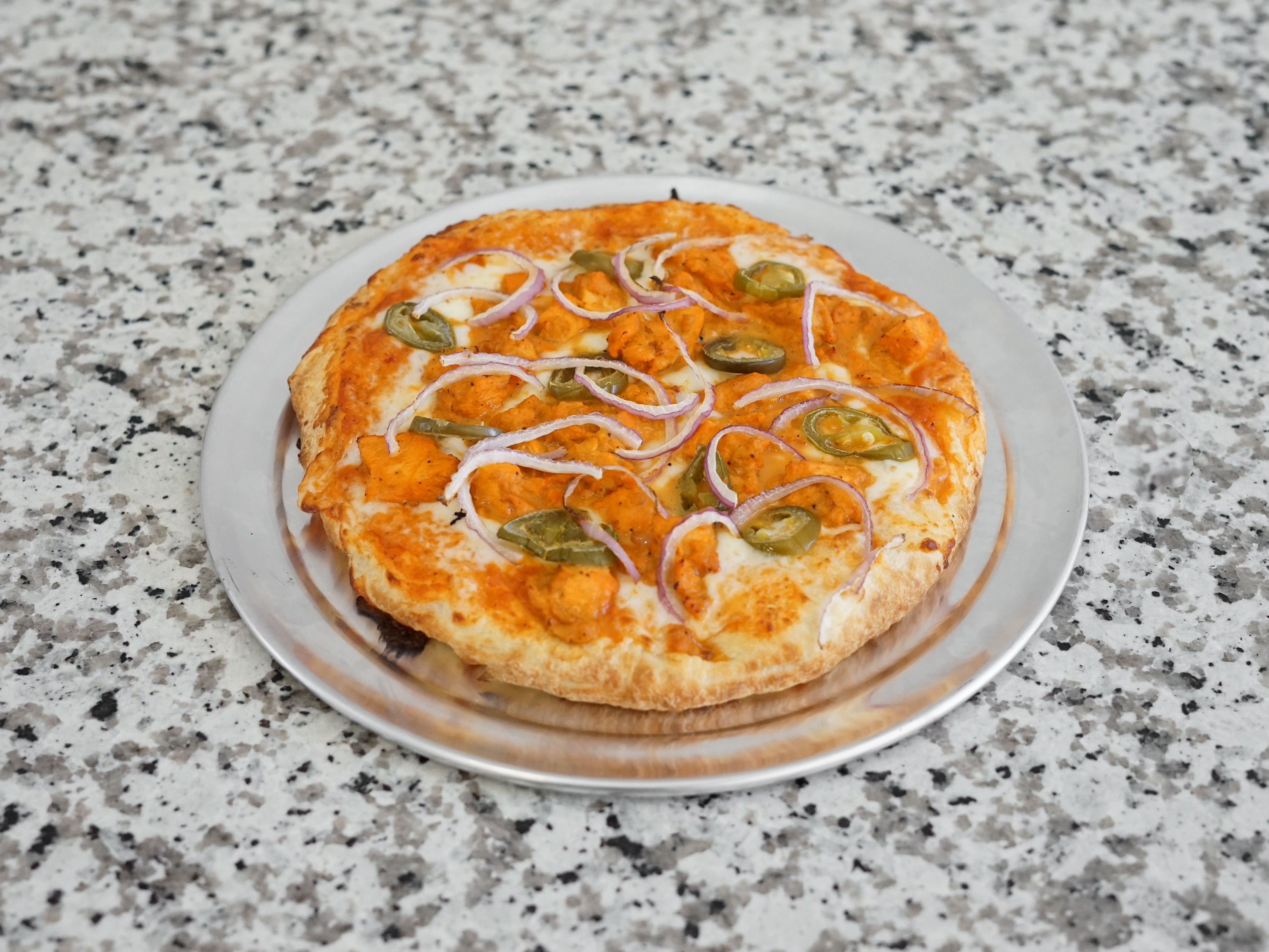 Order Spicy Butter Chicken Pizza food online from Tasty Pizza store, San Jose on bringmethat.com