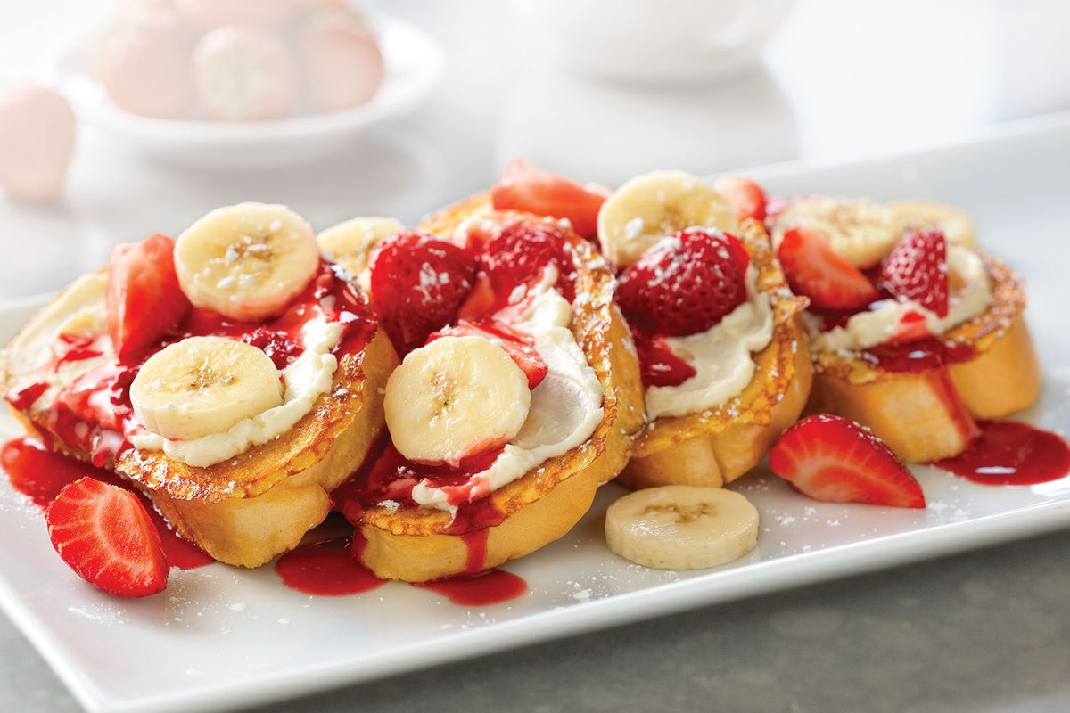 Order Strawberry-Banana Supreme French Toast food online from Village Inn store, Springfield on bringmethat.com