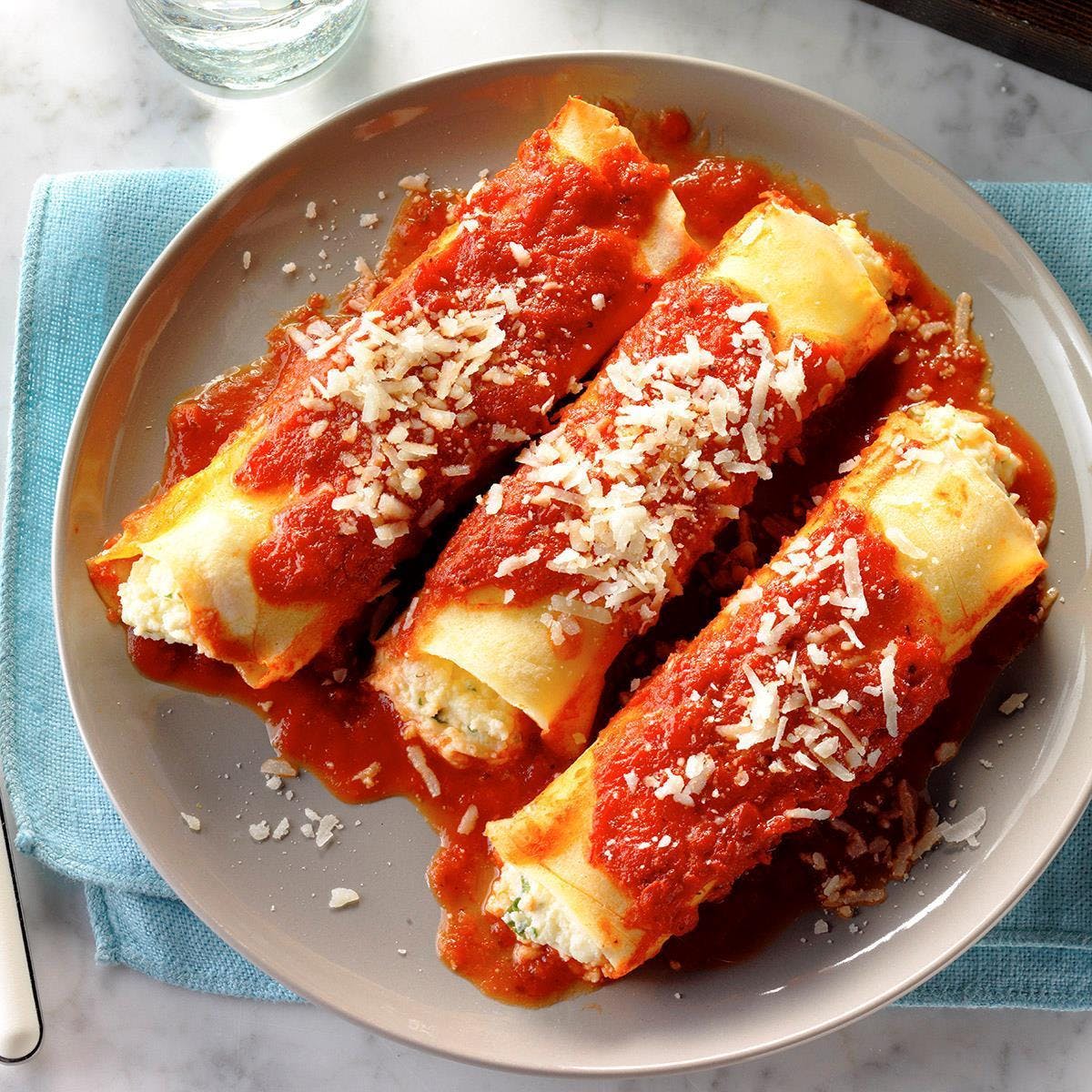 Order Manicotti - Entree food online from Napoli Pizza store, Henderson on bringmethat.com