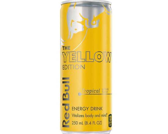 Order Red Bull The Yellow Edition Tropical 8.4 fl oz.  food online from Central Liquor Market store, Los Angeles on bringmethat.com