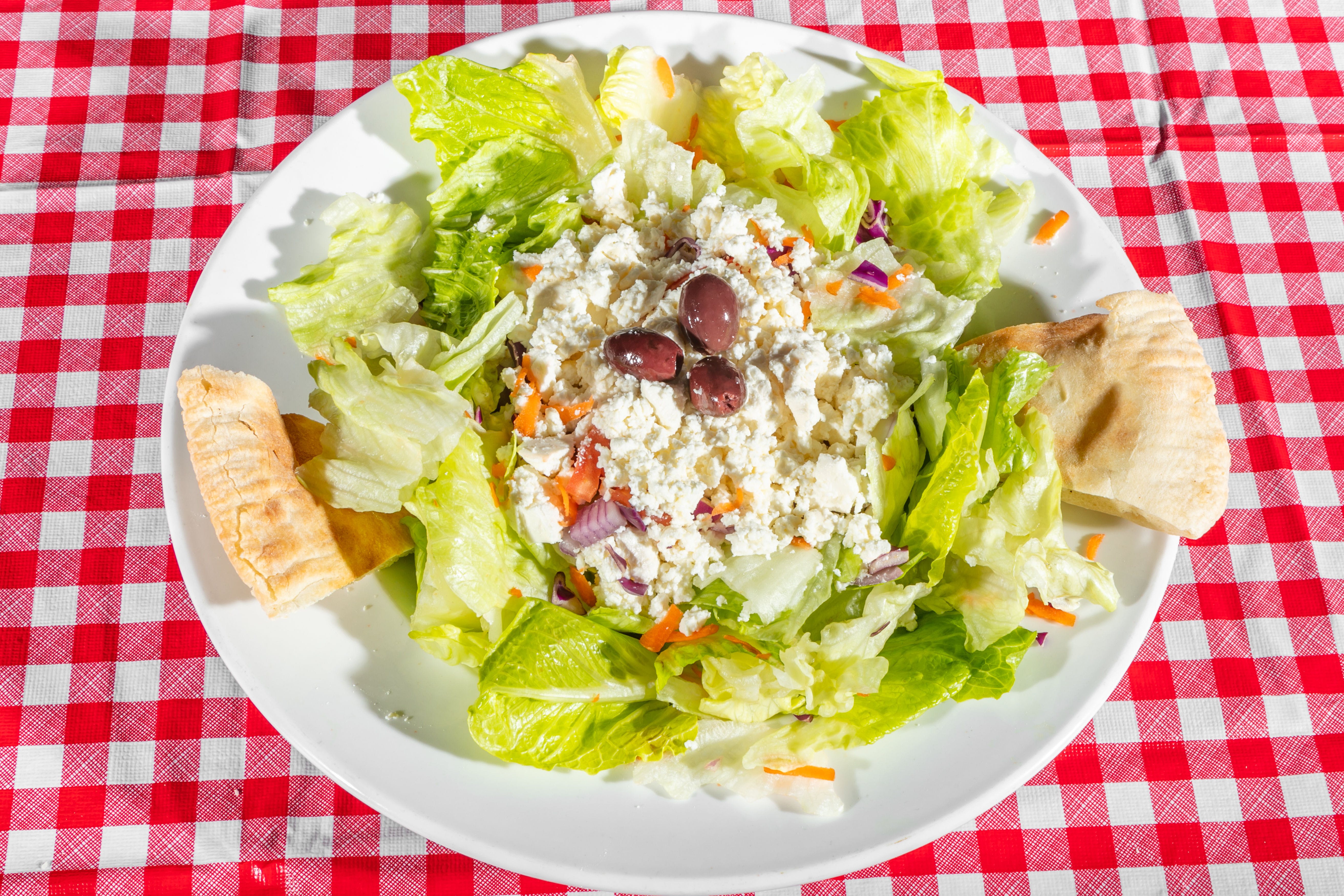 Order Greek Salad - Salad food online from Upper Crust Pizzeria store, Tilton on bringmethat.com