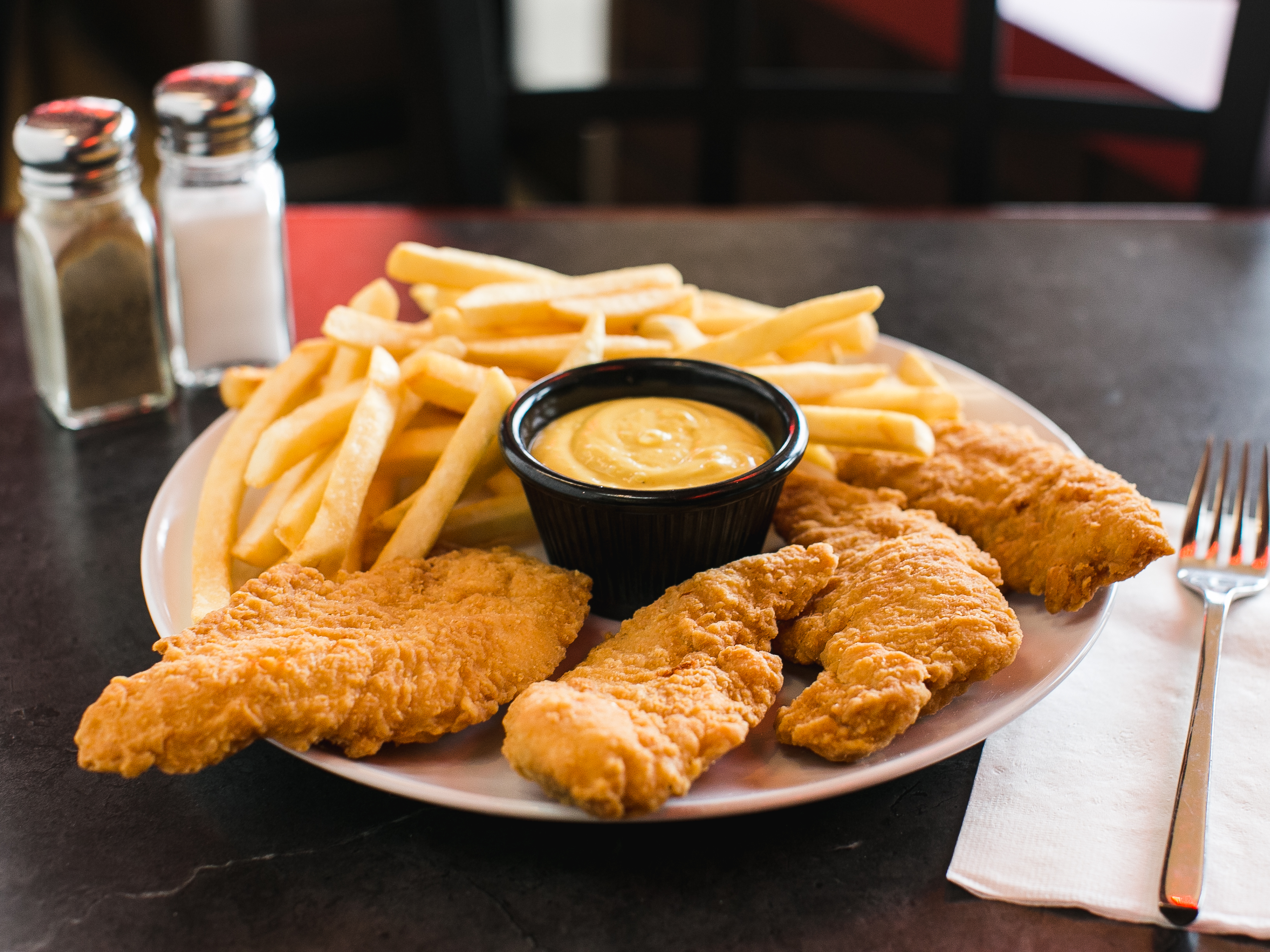 Order 4 Chicken Fingers with French Fries food online from Plaza Pizza store, Cherry Hill on bringmethat.com