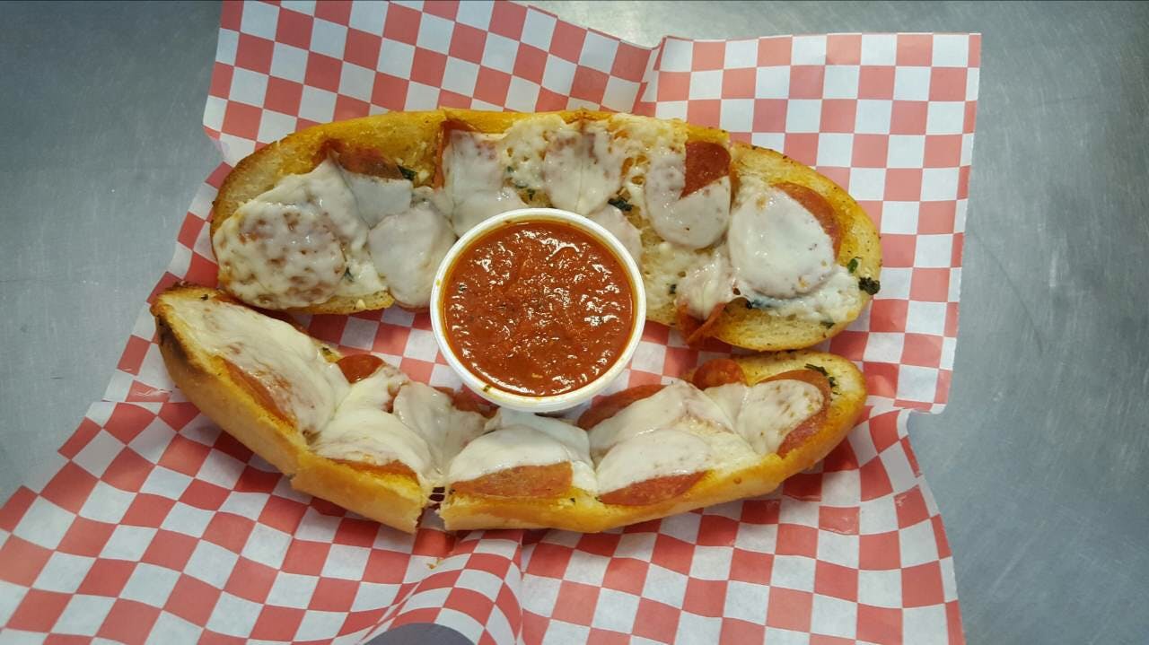 Order Garlic Bread with Cheese - Appetizer food online from Argentos Pizza store, Buckeye on bringmethat.com
