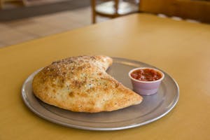 Order Chicken with Vegetable Calzone food online from Massino's Pizzeria store, Aurora on bringmethat.com
