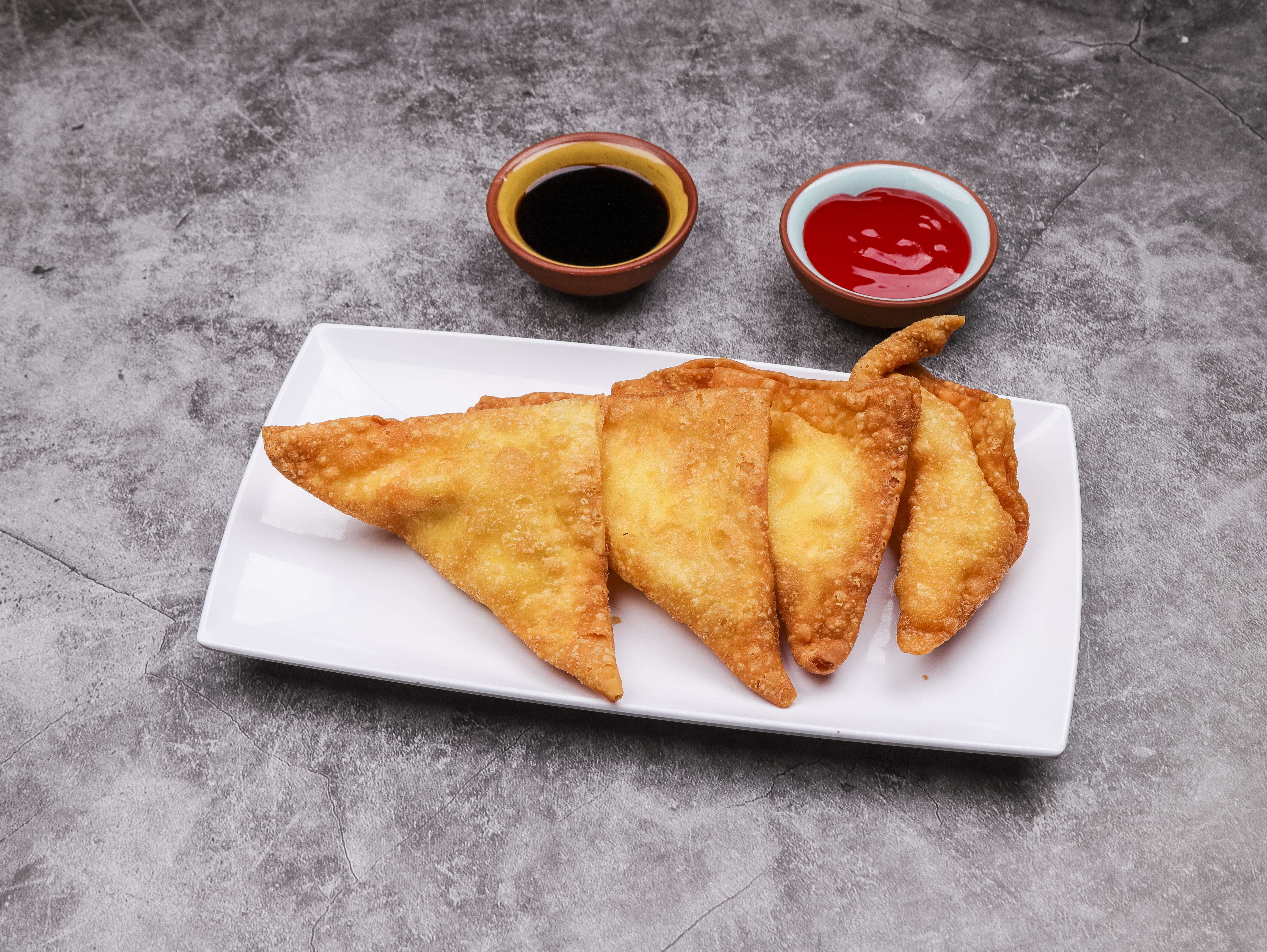 Order 4 Piece Crab Rangoon food online from China Bear Fast Food store, Columbus on bringmethat.com