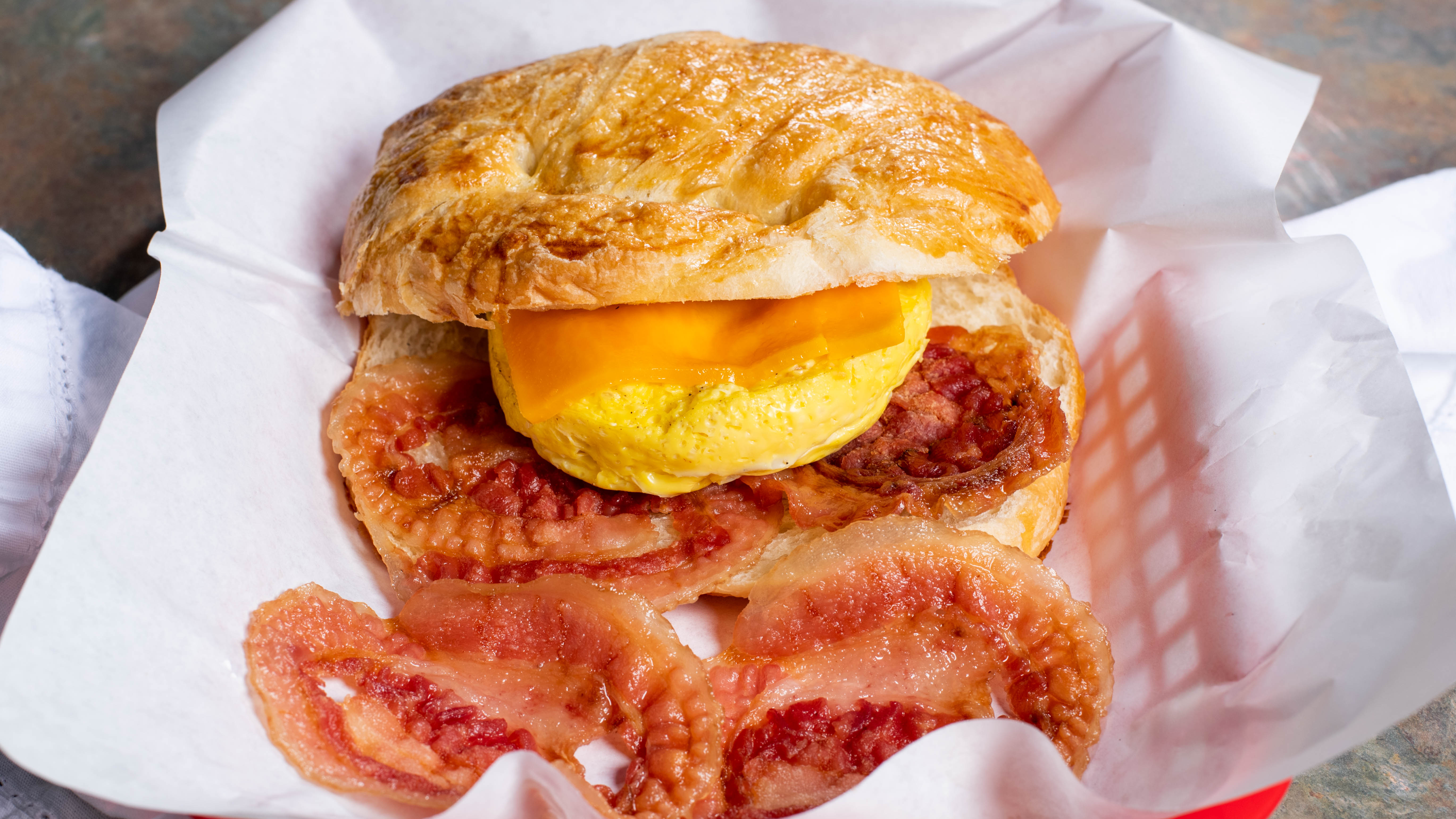 Order 12. Bacon, Egg and Cheese Croissant food online from House Of Bagels And Cafe store, Scotts Valley on bringmethat.com